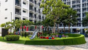 a playground in front of a building at Cozy 619 1BR Shore2 Residence, Near Airport, IKEA, MOA, SMX, Pasay City, Manila in Manila