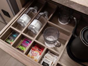 a drawer with some glasses and some food at Mercure Chengdu Wuhou Temple in Chengdu