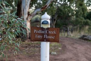 a sign that says peculiar creek tiny house at Pedlar Creek Tiny House by Tiny Away in McLaren Vale