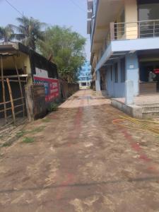 an empty street in front of a building at Chouhan Resort in Katihār