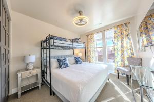 a bedroom with a bunk bed and a window at Historic Main Street Hotel in Pleasant Grove