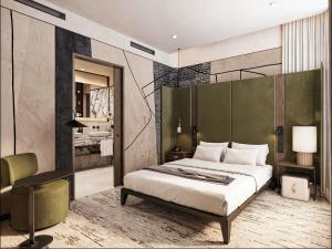 a bedroom with a king sized bed and a desk at Novotel Lviv Center in Lviv
