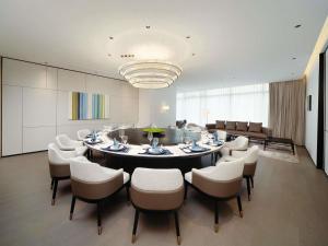 a large dining room with a table and chairs at Novotel Chengdu Lige in Chengdu
