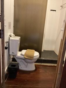 a bathroom with a toilet with a towel on it at เชียงคานคลาสสิค in Chiang Khan