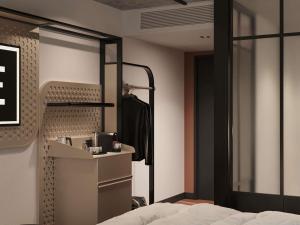 a bedroom with a bed and a mirror and a sink at TRIBE PARIS SURESNES in Suresnes +66 photos