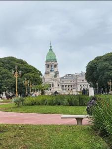a building with a green dome on top of it at Habitacion de congreso in Buenos Aires
