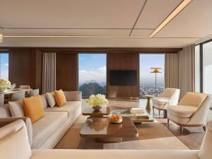 a living room with a couch and a table at Pullman Ninh Binh in Ninh Binh