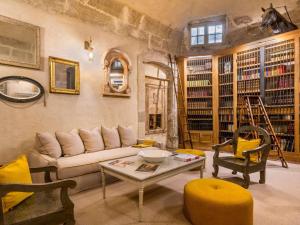 a living room with a couch and a table at Château de Mazan - Handwritten Collection in Mazan