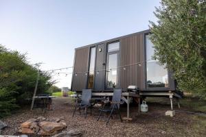 a tiny house sitting on top of a table at Scrub Tiny House by Tiny Away in McLaren Vale