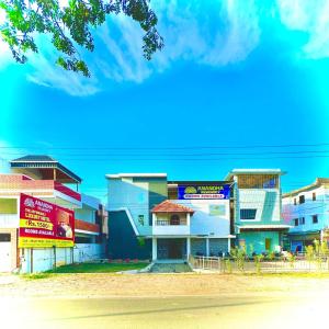 a group of buildings on the side of a street at ANANDHA RESIDENCY in Karaikal