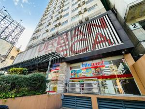 a store front of a building with a large building at Isaiah CityScape in Manila