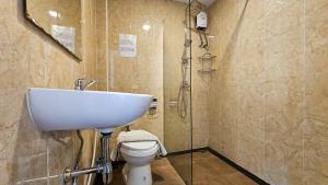 a bathroom with a sink and a toilet at Smyrna in Pattaya +41 photos