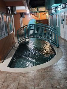 a pool of water with a bridge in a building at Crown Point Condos by Nasin in Crown Point