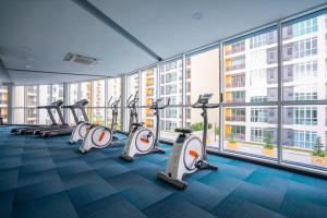 a gym with treadmills and ellipticals in a building at Residences at Daya near Mount Austin by SR Home in Johor Bahru