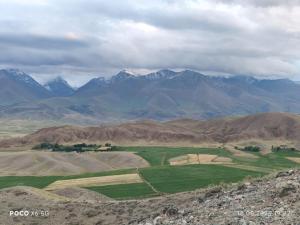 a view of a valley with mountains in the background at Miyar Farmhouse in Ak-Say