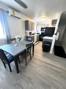 a kitchen and dining room with a table and chairs at Renovated Downtown Phoenix Condo in Phoenix +9 photos