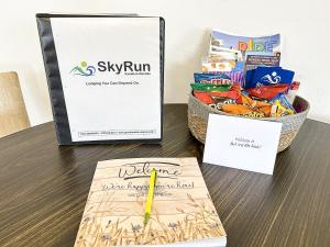 a table with a sign and a basket of snacks at Bark and Bike Abode home in Fruita +50 photos