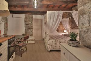 A bed or beds in a room at Cantina del Pescatore