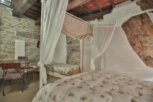 En eller flere senge i et værelse på Cantina del Pescatore