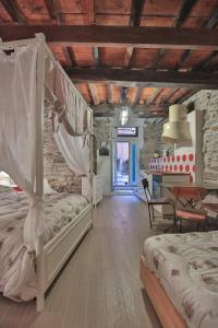 A bed or beds in a room at Cantina del Pescatore
