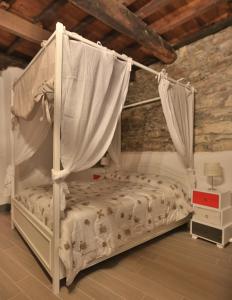 A bed or beds in a room at Cantina del Pescatore