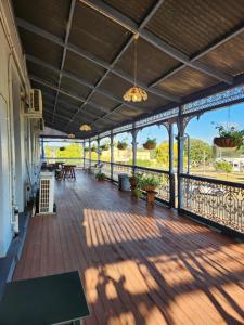 a large deck with a view of the water at Hotel Cecil Wondai in Wondai