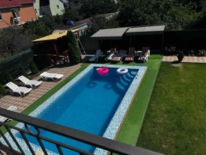 a swimming pool with a frisbee in a yard at Дом с подогреваемым бассейном in Liski