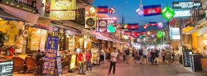 a group of people walking through a market at night at Okay 1 Villa in Siem Reap