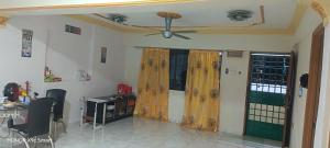 a living room with a ceiling fan and a window at Hot Spring Residential B in Kuala Lumpur