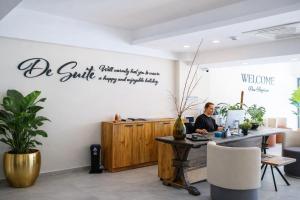 a man sitting at a table in an office at De Suite Hotel in Antalya