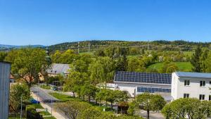 an aerial view of a building with solar panels at Ubytování U Ropáků in Horní Slavkov