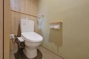 a bathroom with a white toilet in a room at Bonju Abikomichi in Osaka +30 photos