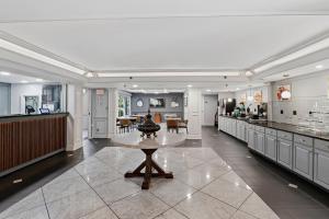 a large kitchen with a table in the middle at Quality Inn Duluth - Atlanta Northeast in Duluth