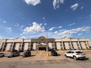 a large building with cars parked in a parking lot at Comfort Inn Festus-St Louis South in Festus