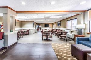 a restaurant with tables and chairs in a room at Comfort Inn Festus-St Louis South in Festus