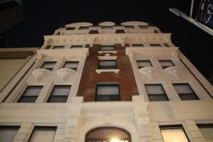 a view of a tall building at night at The Mayfair Hotel Times Square, an Ascend Collection in New York