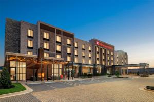 a rendering of a hotel with a parking lot at Hilton Garden Inn Perry in Perry