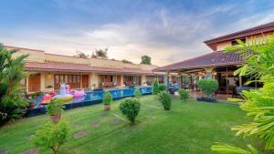 an image of a villa with a swimming pool at Taratai Villa Guest House in Nong Prue