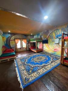 a room with a mural on the wall at Evergreen Lodge in Padang