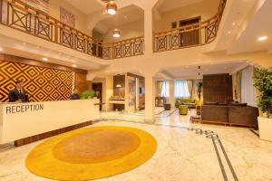a large lobby with a person standing in the center at Udaan Olive Hotel & Spa, Pelling in Pelling