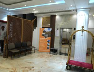 a waiting room with chairs and a sign in a museum at Hotel The Haven Kargil - Centrally Heated in Kargil