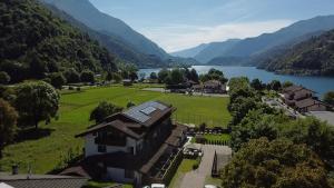 an aerial view of a house next to a lake at Hotel Garni My Ledro in Ledro