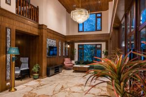 a large living room with a chandelier at Udaan Hotel Pine Crest, Pelling in Pelling