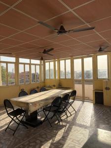 a large room with a large table and chairs at BOBY HOME STAY "BOBY MANSION" Jaipur in Jaipur