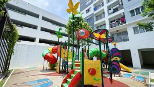 a playground in front of a building with a play equipment at D'Camellia 43500 Semenyih Homestay in Semenyih +26 photos