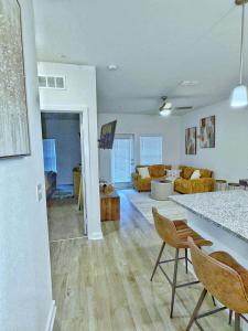 a living room with a table and chairs in a room at Beachline Oasis in Jacksonville