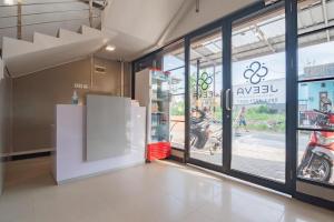a room with a motorcycle inside of a store at RedDoorz Plus near Siloam Hospital Balikpapan in Balikpapan