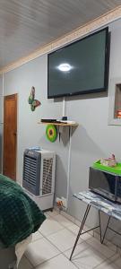 a flat screen tv hanging on a wall at Malan's Siësta 2 in Kimberley