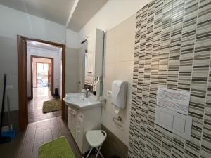 a bathroom with a sink and a mirror at LightHouse - Casa di Luce in Reggio di Calabria