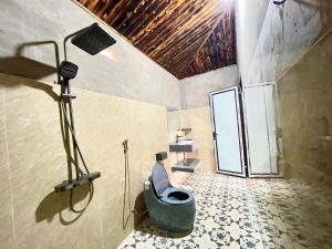 a bathroom with a shower with a toilet and a spotlight at Best View Homestay in Sapa +92 photos